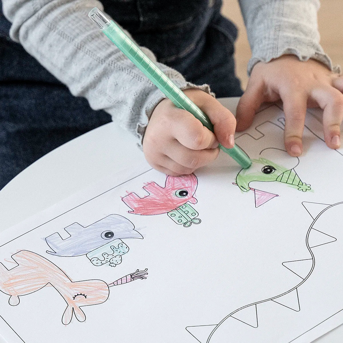 Child colouring a Deer friends drawing